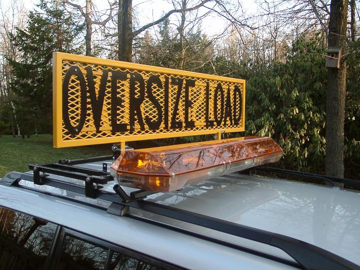 sign 2.JPG - BTI OSL sign with light bar adapter brackets.